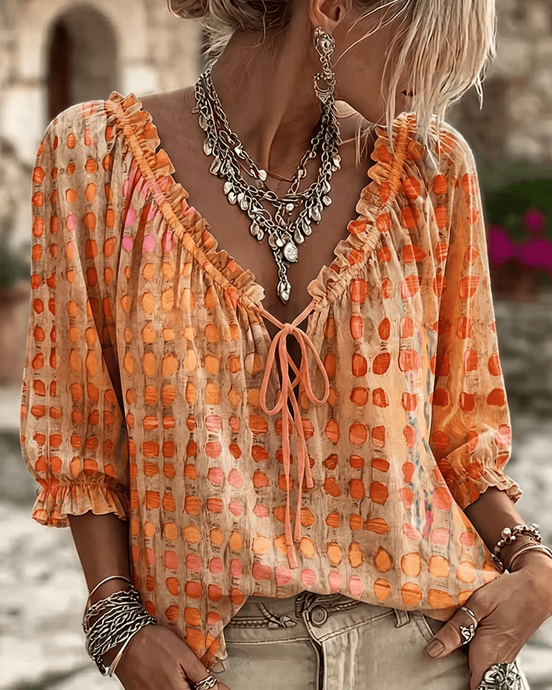 Bluse mit V-Ausschnitt und Spitzendetails