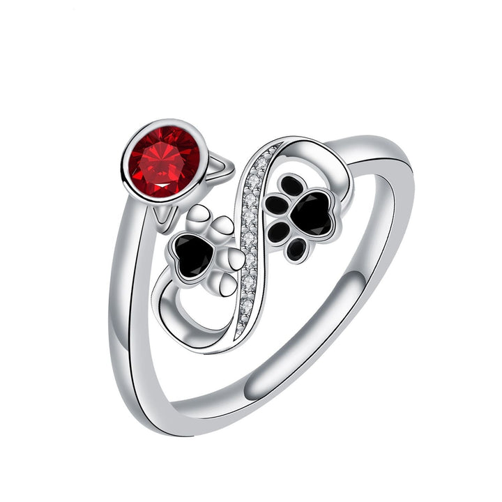 Schwarzer Pfotenabdruck verstellbarer Ring mit roter Gemme