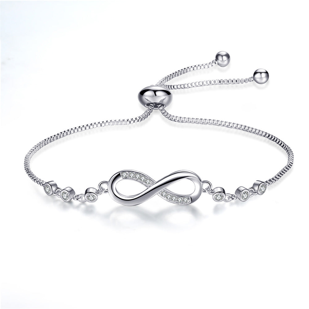 Joli bracelet réglable en or rose en forme de symbole de l'infini