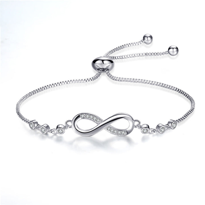 Joli bracelet réglable en or rose en forme de symbole de l'infini