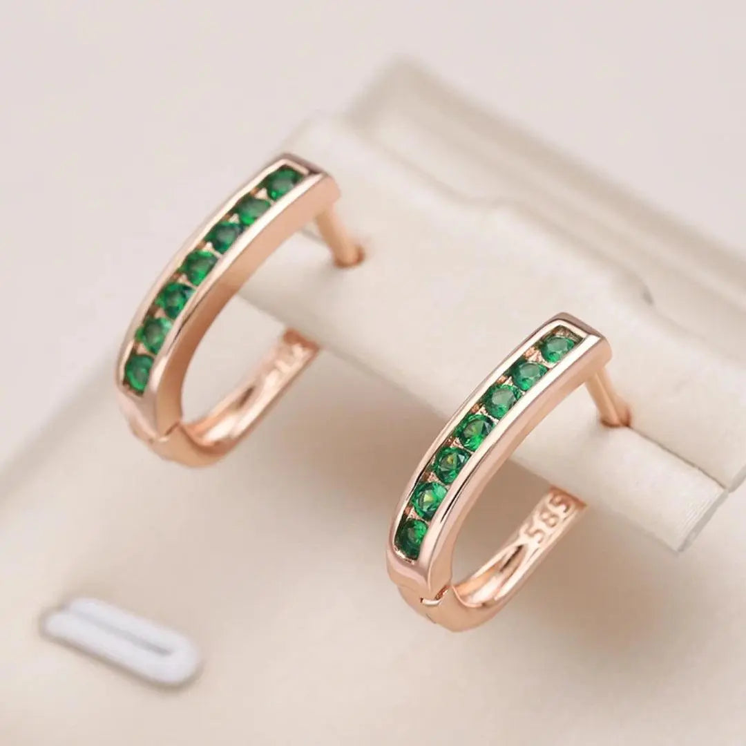 Goldene Ohrringe mit Smaragd-Diamant