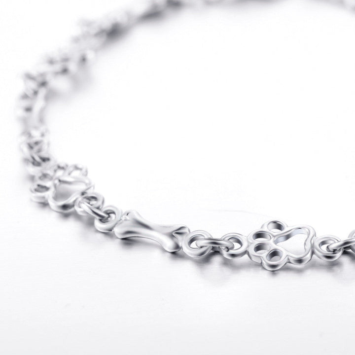 Hundepfote und Knochen Armband in reinem Silber
