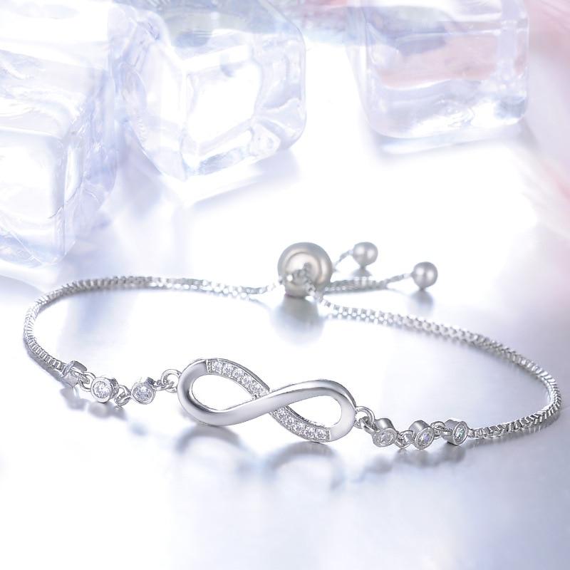 Joli bracelet réglable en or rose en forme de symbole de l'infini