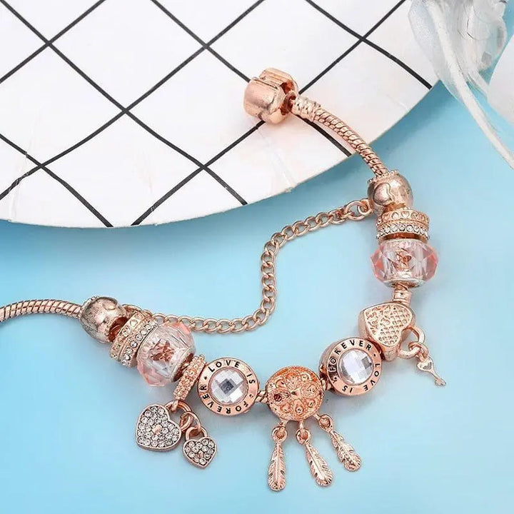 Rosa Traumfänger Armband mit Silbernen Charms