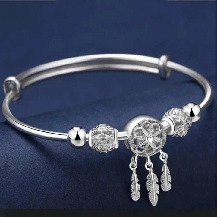 Rigi­des Traumfänger-Armband in Silber