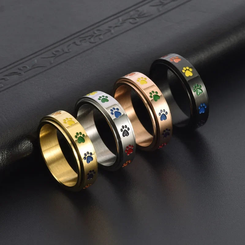 Drehender Stress-reduzierender Pfoten Ring in Edelstahl mit Regenbogenpfoten