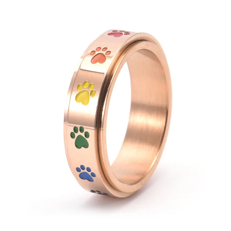 Drehender Stress-reduzierender Pfoten Ring in Edelstahl mit Regenbogenpfoten