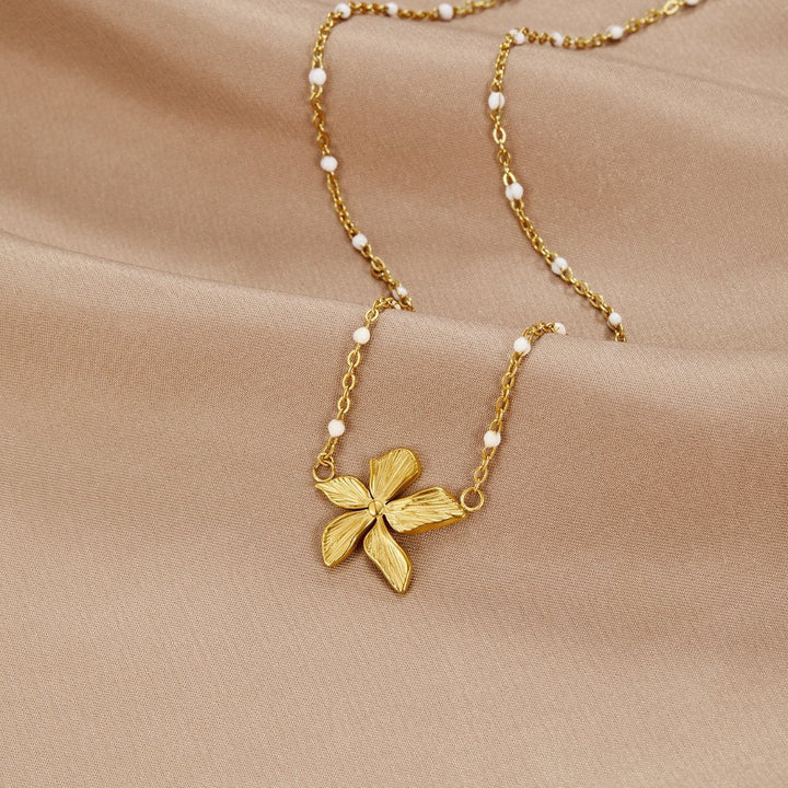 Elegante Halskette mit Goldblume